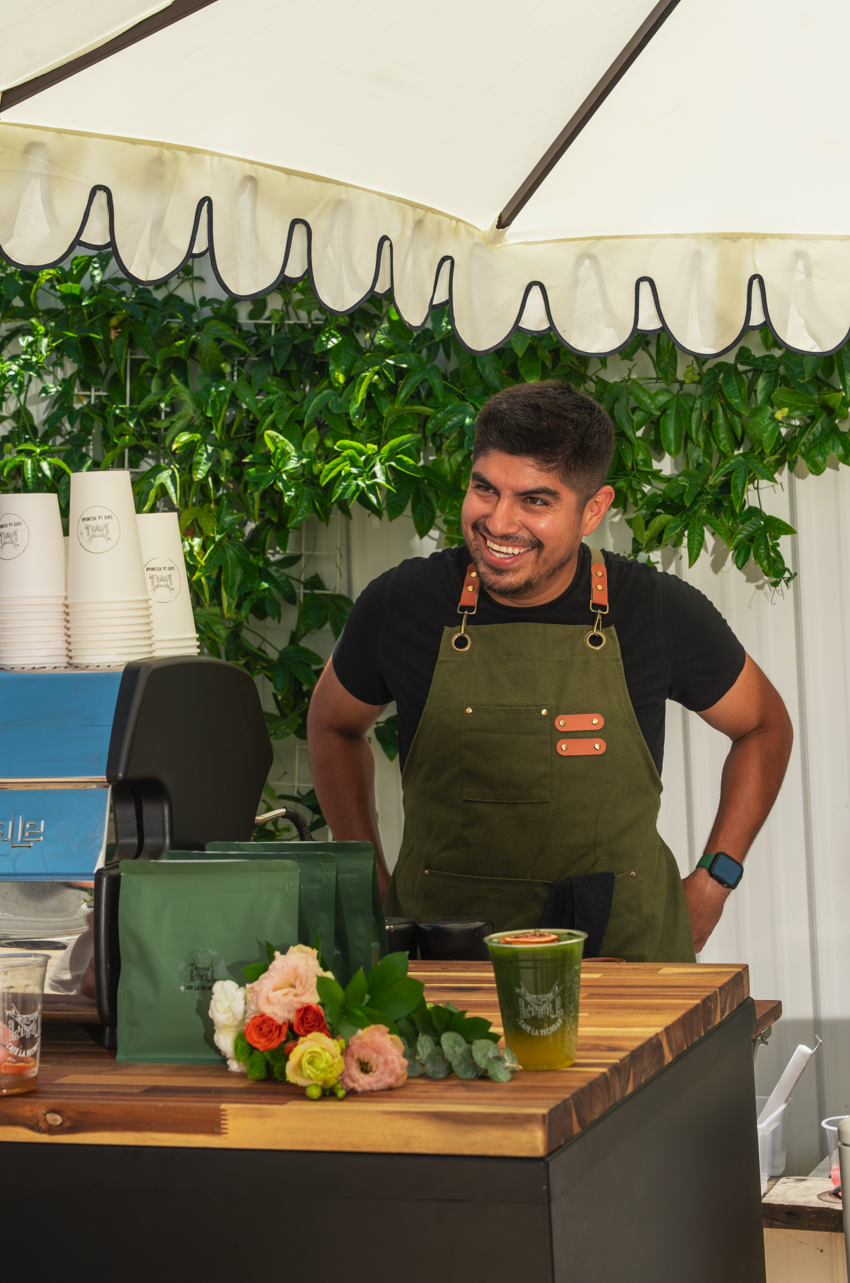 Vendor pouring drinks at the beverage lab